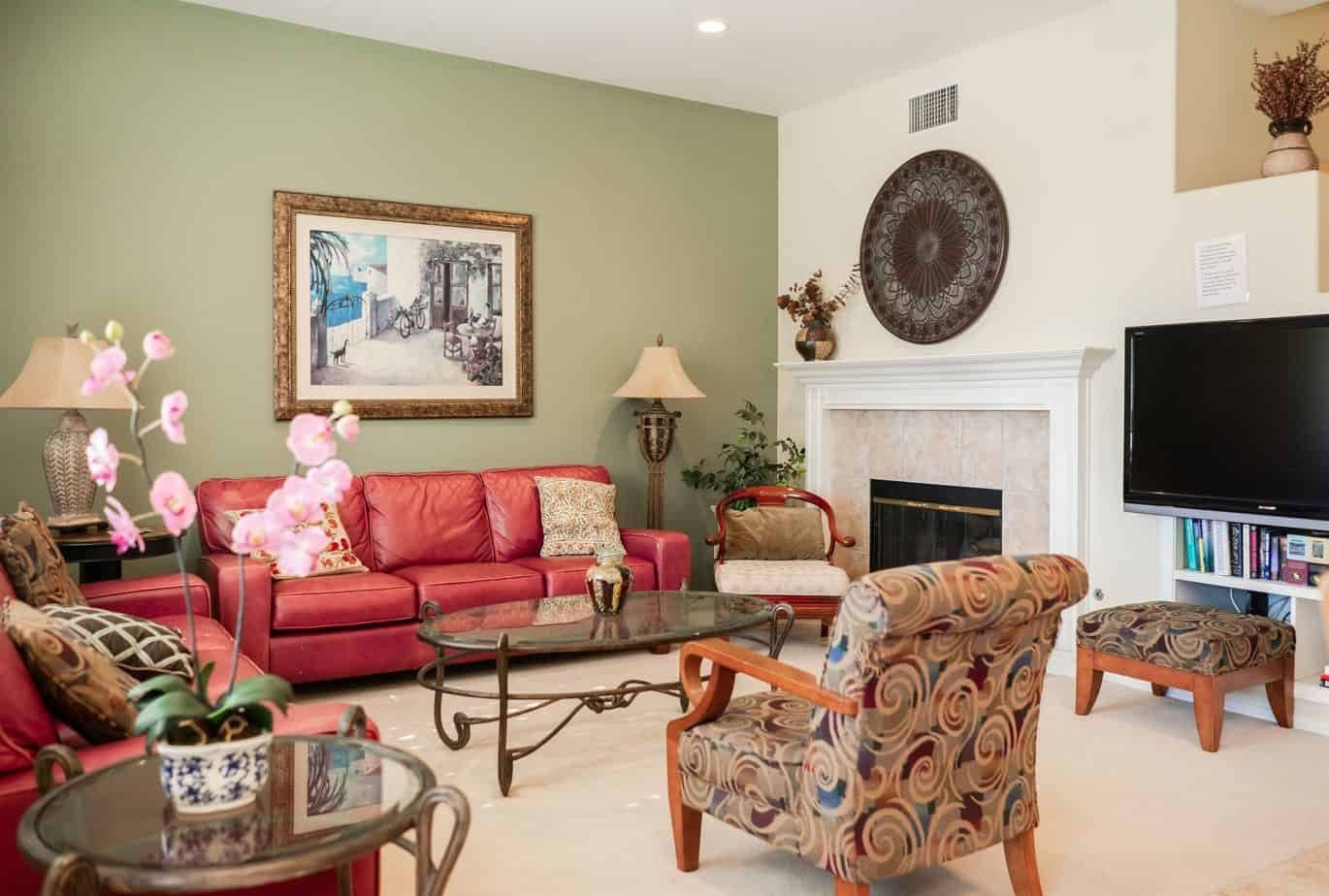 Second lounge with a fireplace and armchairs